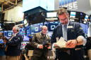 Wall Street rises, limps across the finish line of a turbulent year