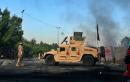 Iraq blames 'malicious' hands as toll from unrest tops 100