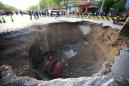 Guy falls into a giant sinkhole because he was too busy looking at his phone
