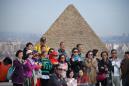 Tourists throng Egypt pyramids after bombing, but future clouded