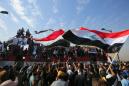 Iraqis rally to revive year-old revolt against the system