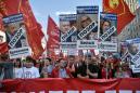 Putin signs unpopular pension reform into law despite protests