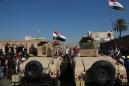 Iraq protesters storm Baghdad bridge, medic killed