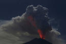 Bali airport reopens as volcano rumbles