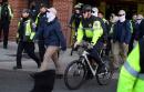 Masked white nationalists march in Washington with police escort