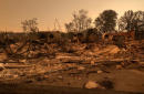 California fire 'tornado' kills two firefighters, thousands flee