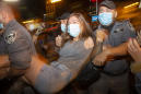 Israeli police use water cannons on protesters, arrest 55