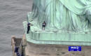 The Latest: Statue of Liberty base climber identified