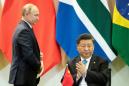 Putin, Xi slam attempts to blame China for late virus response