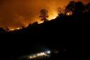 California crews hold wildfire in check, letting more residents go home
