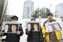 China bristles at Canada over duo detained on spy charges