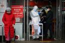 South Korea virus cases surge as WHO sounds maximum alert