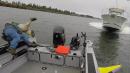Fishermen dive into river moments before motorboat smashes into vessel