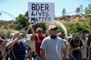 South African white farmers, rival Black protesters face off over farm murder case
