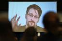 Snowden says he would return to US if he can get a fair trial