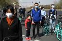 Asia virus latest: China mourns dead, S. Korea extends social distancing