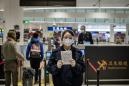 Beijing orders quarantine for foreign arrivals from virus-hit areas