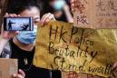 Hong Kong office workers, schoolmates denounce police shooting of teen