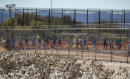 US waived FBI checks on staff at growing teen migrant camp