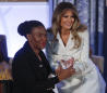 First lady helps present courage awards to 13 women