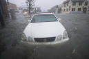 AP Photo Gallery: Sally's deluge swamps streets, ruins cars