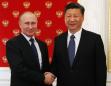 Russia's Putin, China's Xi talk trade, North Korea at Kremlin