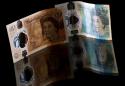 Pound plunges as UK ministers quit over Brexit deal