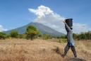Bali's Agung volcano spews ash in fresh eruption