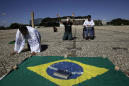 Brazilians start defying isolation, egged on by Bolsonaro