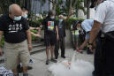 Hong Kong police arrest 60 for protesting on China holiday