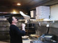 Pizzeria borrows to keep workers on job, spurs donations