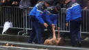 Topless Protester Gets Within Feet Of Trump's Motorcade In Paris