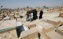 Defying fatwa, Iraqis flock to COVID cemetery to exhume dead, re-bury elsewhere