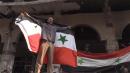 Syrian flag flying over onetime rebel stronghold Douma as Russians announce victory in Eastern Ghouta