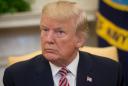 Trump praises aide amid White House abuse scandal
