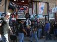 Sturgis motorcycle rally attendees lounge in bikinis, pack into bars, and mock mask wearers: 'It's like COVID does not exist here'