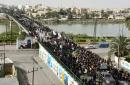 Iraq Shiites defy curfews to commemorate revered imam