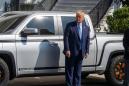 Trump avoids tax return questions as he brings yet another truck to the White House