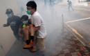 Police fire tear gas as thousands protest in Hong Kong over proposed security laws