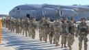 Iran warns U.S. over Iraq deployment amid virus