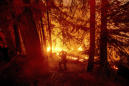 Firefighters overtaken by flames in California mountains
