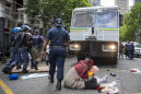 South African police arrest 100 after refugees protest