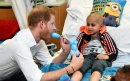 Prince Harry shows off paternal side during visit to children's hospital
