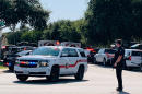 3 Texas officers shot by gunman, who holds 3 people in home