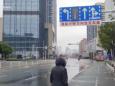 A teacher's videos inside quarantined Wuhan show the streets eerily deserted and lines out the door at the pharmacy