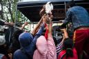 Indonesia clamps down on looting as quake-tsunami toll tops 1,200