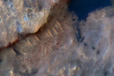 Curiosity rover is seen creeping up a rugged Martian mountain