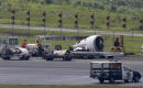 Plane skids off rainy Manila runway, rips off engine, wheel