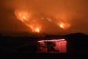 Biggest LA fire spreading more slowly as survivors pick up the pieces