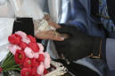 AP PHOTOS: Iraqi couple gets police help to wed amid curfew